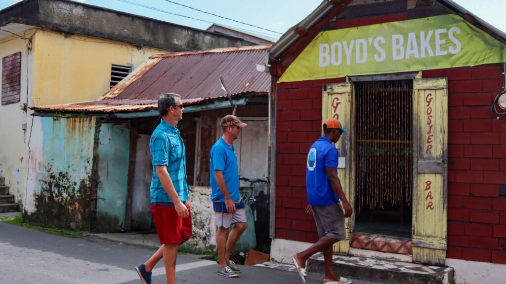 Ken Whiting and local guides in Dominica visiting a seafood shack